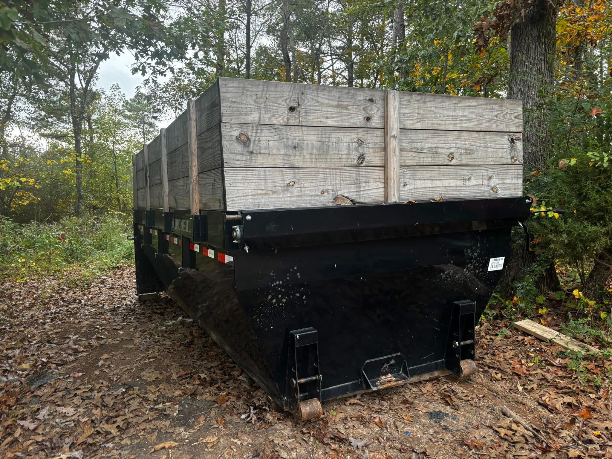 Minutemen dumpster with wooden side boards